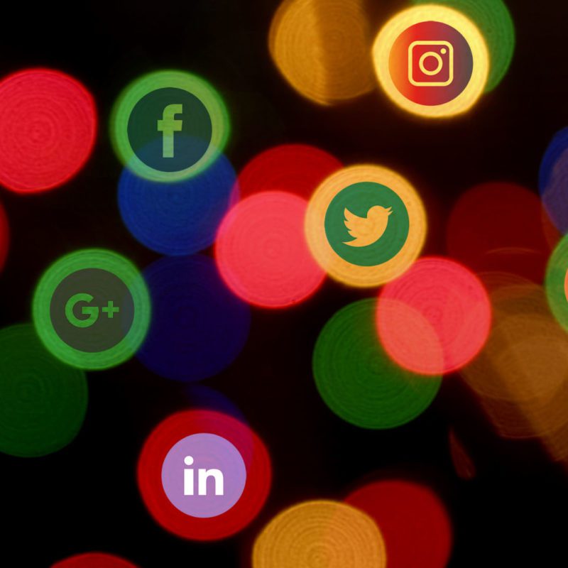 Social media logos on blurred lights background